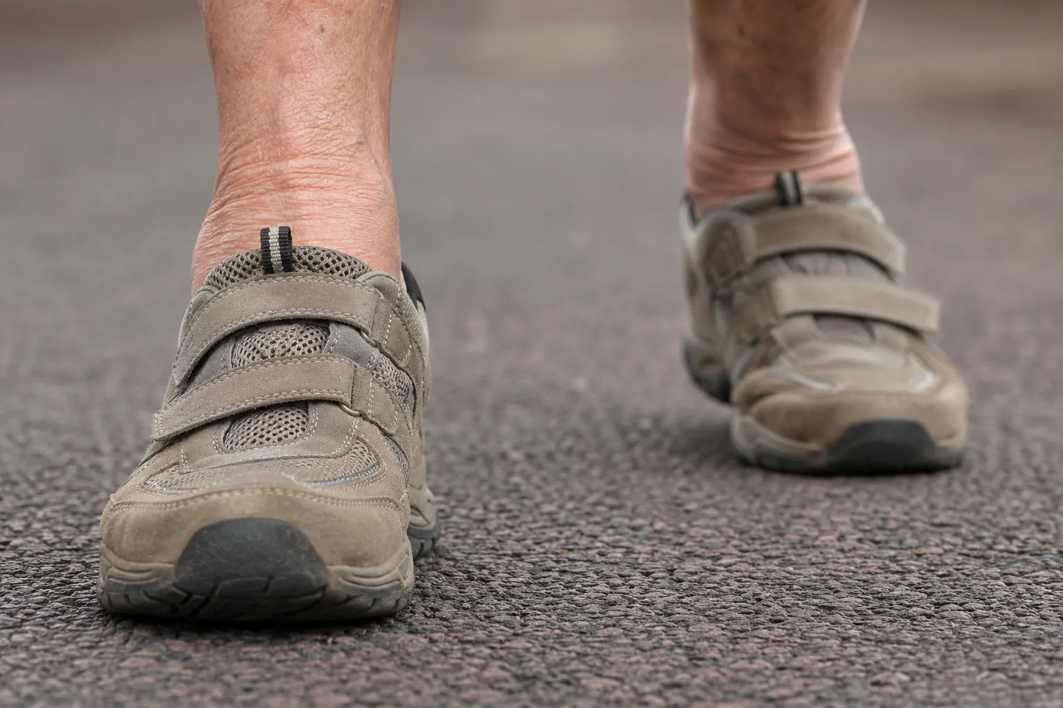 Older adult walking comfortably outdoors